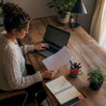 Customer support manager reviewing SLA documents in office