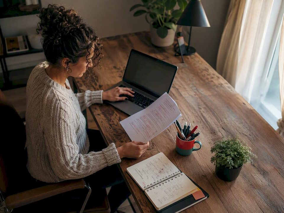 Customer support manager reviewing SLA documents in office