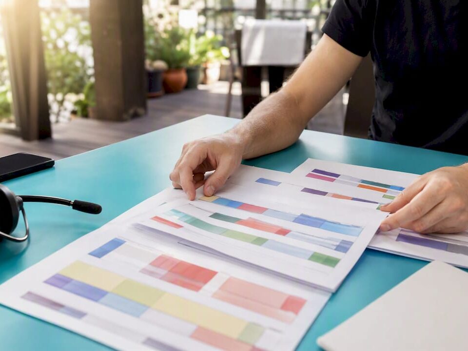 Hands arranging surge staffing schedules